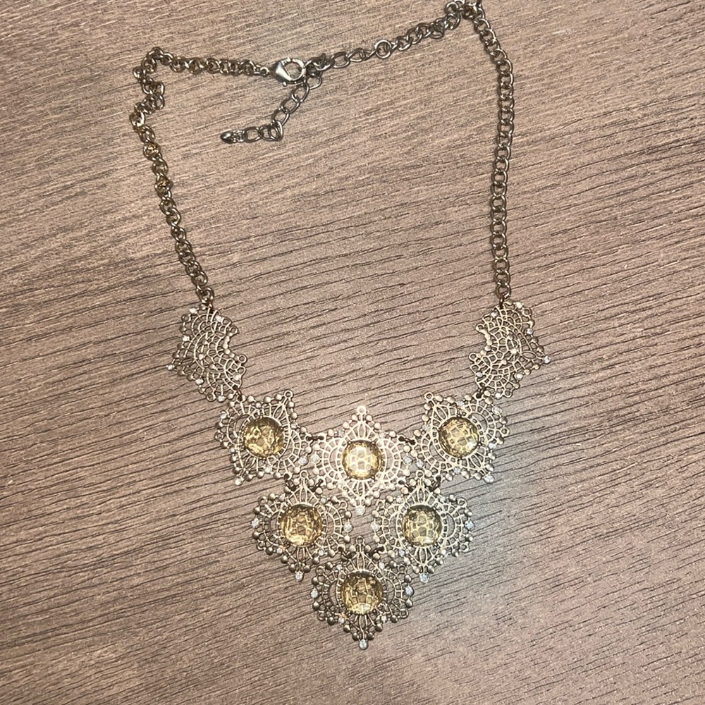 Gold statement necklace with yellow gems